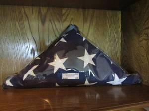 lot 85 image: Folded American flag in a bag to keep protected.