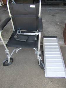 lot 94 image: black  Guardian wheel chair,medium size & a foldable ramp for entry in to doorways for a wheel chair or scooter chair
