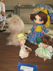 lot 125 image: Paper mache wide eyed  doll 11 tall, various other dolls no names