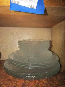lot 162 image: Serving for 4 clear glass dish set, dinner plates, saucers, bowls, salad plates