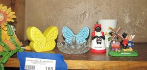 lot 165 image: butterfly salt & pepper shaker, sun flower sitting on counter, Louisianan Gumbo lady