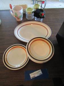 lot 186 image: BUFFALO brown rim dishes plates and bowls, butter dish, coffe mug, oval dinner plate