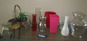 lot 196 image: Large lot of clear glass and colored flower vases, wicker basket handled, 1 milk glass vase