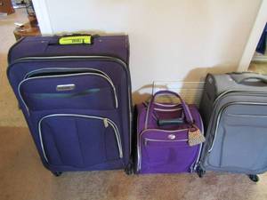 lot 212 image: Coleman rolling luggage bag, American tourist carry on bag, Revo luggage bag