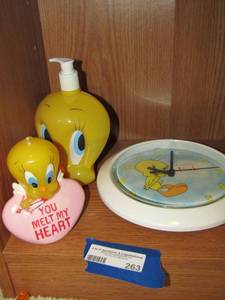 lot 263 image: TWEETY soap dispencer, tweedy love wall clock, you melt my heart candle of tweedy