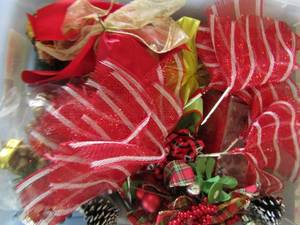 lot 284 image: Clear tote full of dcor and wrapping bows and ribbon