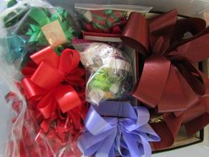 lot 285 image: clear tote of bows large and small, ribbon for gift wrapping and more