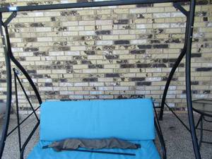 lot 339 image: outdoor patio swing with side glass top table, swing needs minor repair easy fix pictured