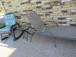 lot 340 image: outdoor LOUNGE  with cushion, small glass top table and a rocking patio chair
