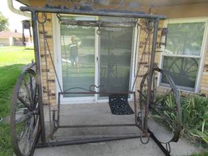 lot 353 image: outdoor vintage wagon wheel swing with western dcor, needs new wood on wheels 826941