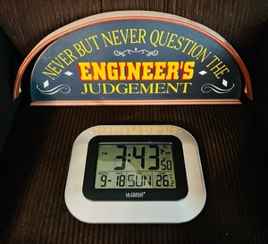 lot 77 image: Comedic Engineer Wall-Hanging Sign &amp La Crosse Technology Model WT-800S Atomic Clock