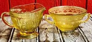 lot 97 image: Vintage Amber Depression Ware Creamer &amp Sugar Bowl of Different Brands