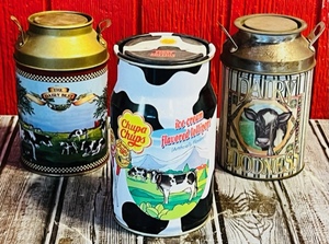 lot 167 image: Chupa Chups First Edition Tin Bank W Two Other DairyMilk Can Themed Tins