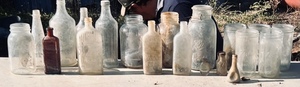 lot 106 image: Huge Lot of AntiqueVintage Glass Bottles &amp Jars - Including Ball Jars, Gesharut Eagle Bottle, Cork Stoppered Bottles, Bauer Aspirin, Creomulsion Cough Syrup, Merrills Rubbing Alcohol, HJ Heinz Products, Mason