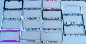 lot 170 image: 15 Vintage Car Dealership License Plate Rings