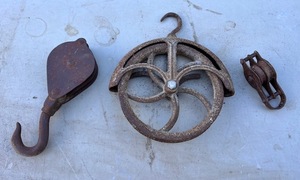 lot 204 image: Three Antique Pullies