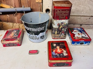 lot 223 image: Three Vintage Unlock the Magic Oreo Tins, Johnny Walker Tin, Meloids Tin, &amp Jagermeister Bucket