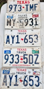 lot 252 image: Four Texas Truck License Plates &amp One Passenger Car Plate