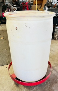 lot 99 image: 25 Gallon Water Barrel W Spigot &amp Wheeled Push Cart