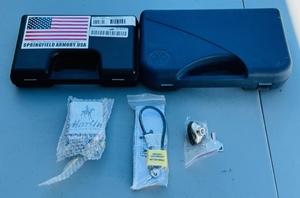 lot 65 image: One Springfield Armory Scope Case, One Pistol Hardcase, &amp Three Assorted Gun Locks