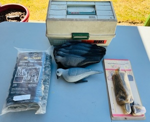 lot 71 image: Hide Um Hunter Real Tree Camo Material, Six Dove Decoys, Mojo Critter, &amp Rebel 600 Tackle Box