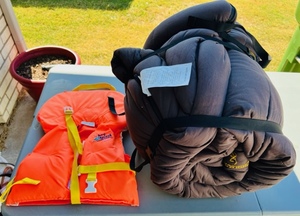 lot 75 image: Once Used Browning Sleeping Bag &amp Stearns Splash Zone Infant Life Jacket