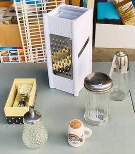 lot 220 image: Kitchen Lot - Includes Sugar Dispensers, Fancy Wine Bottle Stopper, Niagara Falls Toothpick Holder &amp Cheese Grater