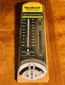 lot 240 image: New Monroe Shocks Metal Advertising Thermometer
