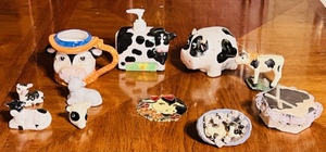 lot 249 image: Eleven Piece Cow Collector Lot - Including Vintage Hard to Find Russ Berrie Cowboy Cow Mug #15932, Rare Certified International Pat Meyers Soap Dispenser, & Cow Coin Bank
