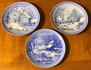 lot 251 image: Three Currier and Ives Collector Plates - The Old Homestead in WinterA Home in the WildernessThe Farmers Home-Winter
