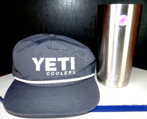 lot 14 image: YETI TUMBLER WITH LID AND PROMO HAT