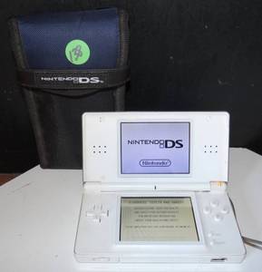 lot 138 image: NINTENDO DS GAME SYSTEM WITH X-MEN THE OFFICIAL GAME PLUS CASE