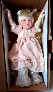 lot 153 image: ASHTON DRAKE PORCELAIN DOLL WITH RAISED ARMS - WBOX