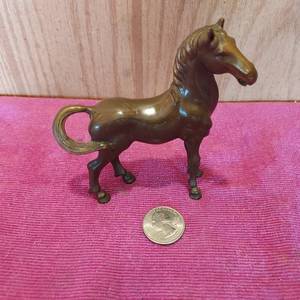 lot 63 image: small horse figurine possibly bronze.  very heavy for size
