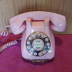 lot 55 image: Pink push button phone made to look like a rotary phone