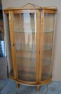 lot 3 image: Lighted Curio Cabinet - Half Moon Shape 35W x 15D x 5Ft. H