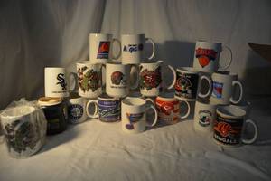 lot 86 image: Sports Team Coffee Mugs as shown
