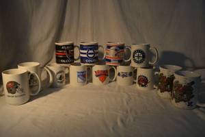 lot 87 image: Sports Team Coffee Mugs as shown