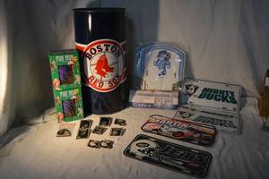 lot 88 image: Sports Items Trash Can, License Plates, Fun Mugs and Pins, see pictures