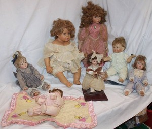 lot 73 image: Vintage Dolls Includes One holding Firefly, Porcelain Dolls, Wind-up Dolls and More, see pictures