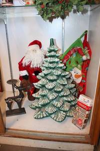 lot 96 image: 2 Ft. Ceramic Christmas Tree, Decorative Santa Figurine, Christmas Stockings, Lights and Reindeer Candle Holder
