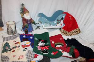 lot 104 image: Christmas Stockings, Santa Hat, Wooden Sleigh Decoration, and Santa Figurine