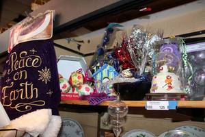 lot 125 image: Purple Dcor Deva Lot Unopened Plush Tree Skirt, Scooby-Doo Globe, Purple Ornaments, Unopened Goblet, Ceramic Dcor and More