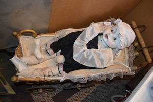 lot 22 image: Large Ceramic Doll in Vintage Doll Stroller as shown