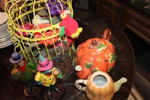 lot 446 image: Yellow Decorative Birdcage with Flowers, Pumpkin Teapots, Parrot Figurines