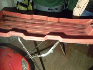 lot 488 image: Serving Tray Stand, and 2 Red Plastic Snow Sleds