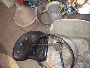lot 489 image: Vintage Tractor Seat, Steering Wheel, Funnel, and Mechanical Pitcher