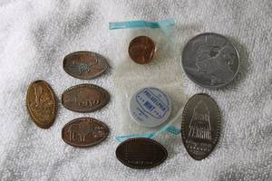 lot 262 image: Jewelry Souvenir pressed coins and Space Jam Toon Squad token. Includes a 1964 Philadelphia uncirculated penny