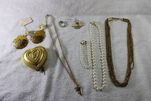 lot 268 image: Jewelry Signed jewelry selection. Includes faux pearl necklace and Carolee bracelet, Sarah Coventry, Debbie Palmer compact in heart form, Berebi earrings, Park lane, Avon, Richelieu
