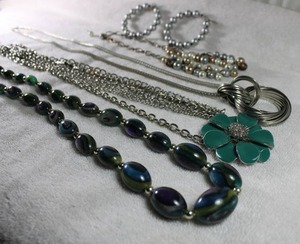 lot 266 image: Jewelry (4) retro necklaces. Faux pearl necklace has matching earrings. Green flower necklace is enamel